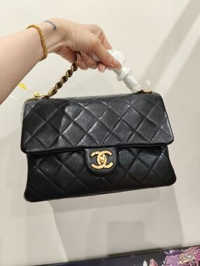 CHANEL Black Quilted Leather Shoulder Bag with Gold CC